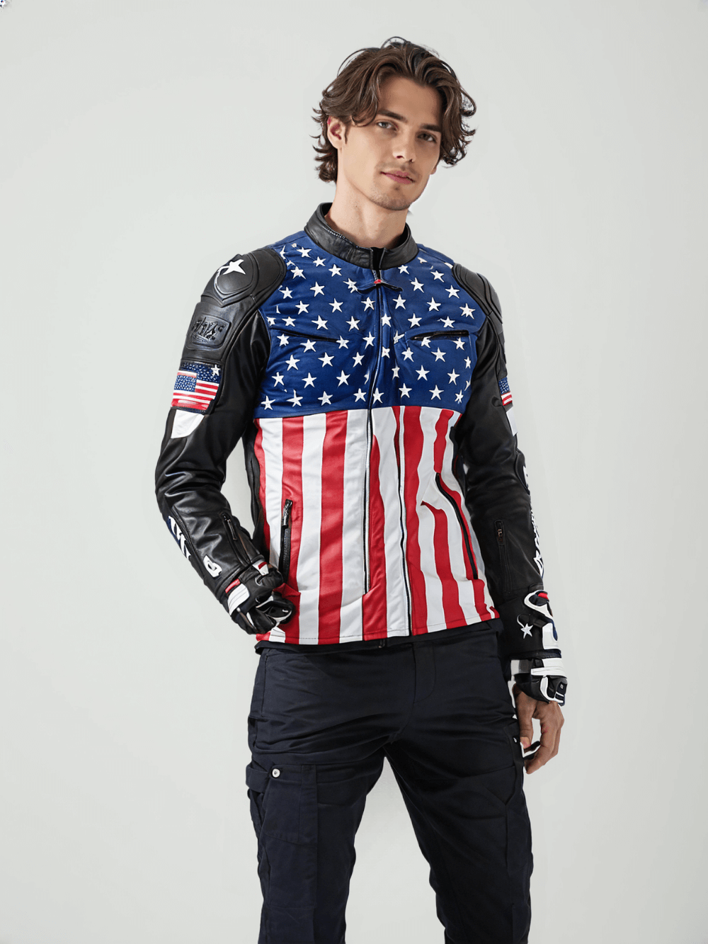 A detailed view of the jacket’s black leather sleeve with protective padding, USA flag patch, and brand logos.