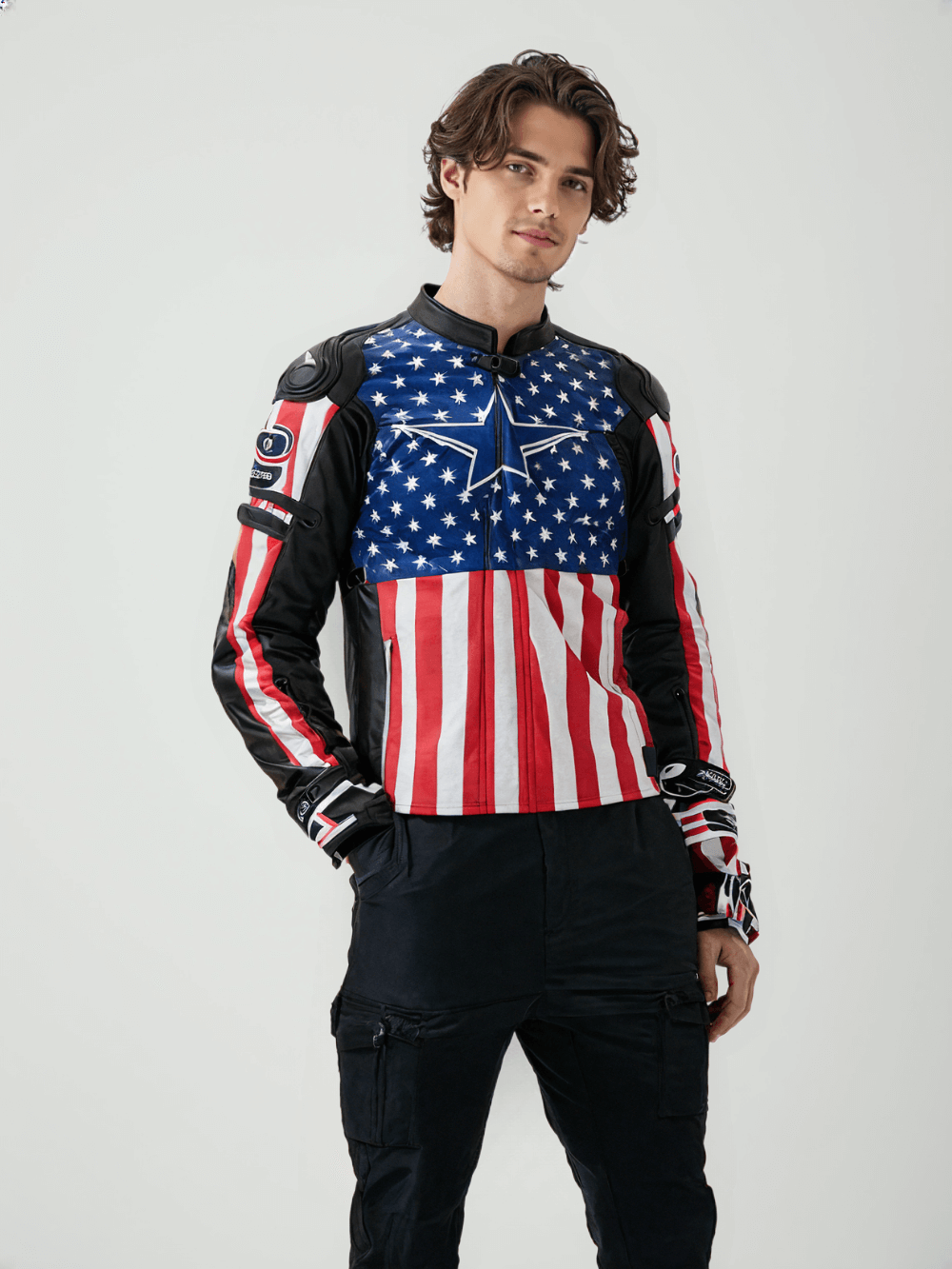 Detailed view of a racing jacket with an American flag motif, black leather sleeves, and reinforced gloves.