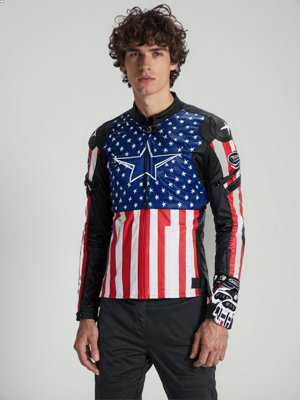 Close-up of a stylish motorcycle jacket with red, white, and blue leather, designed for protection and style
