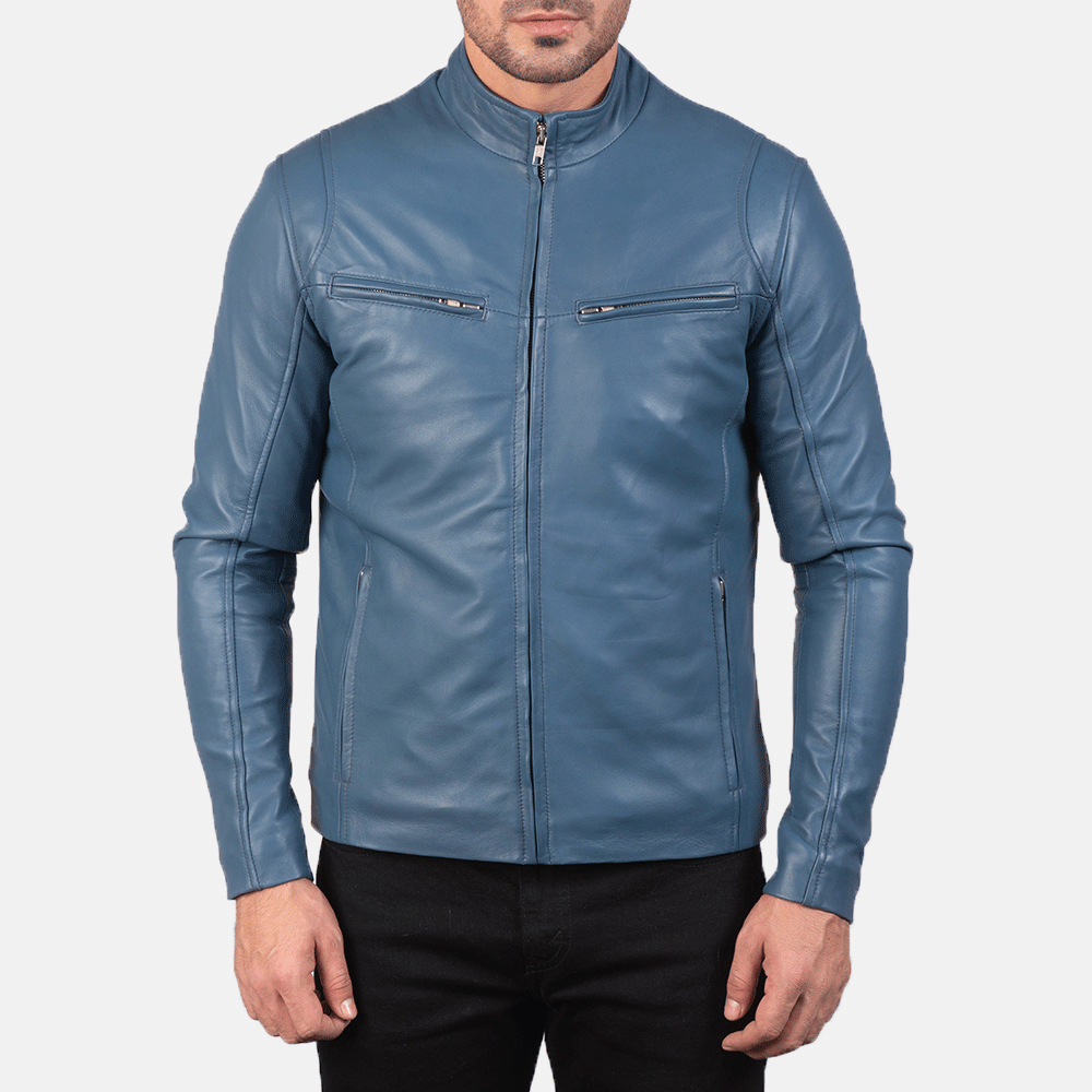 A man wearing a turquoise blue leather motorcycle jacket with a mandarin collar, zipper details, and embroidered leather accents on the arms.