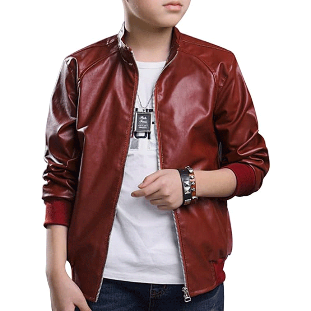 A child wearing a red leather motorcycle jacket with a white shirt underneath and black pants.