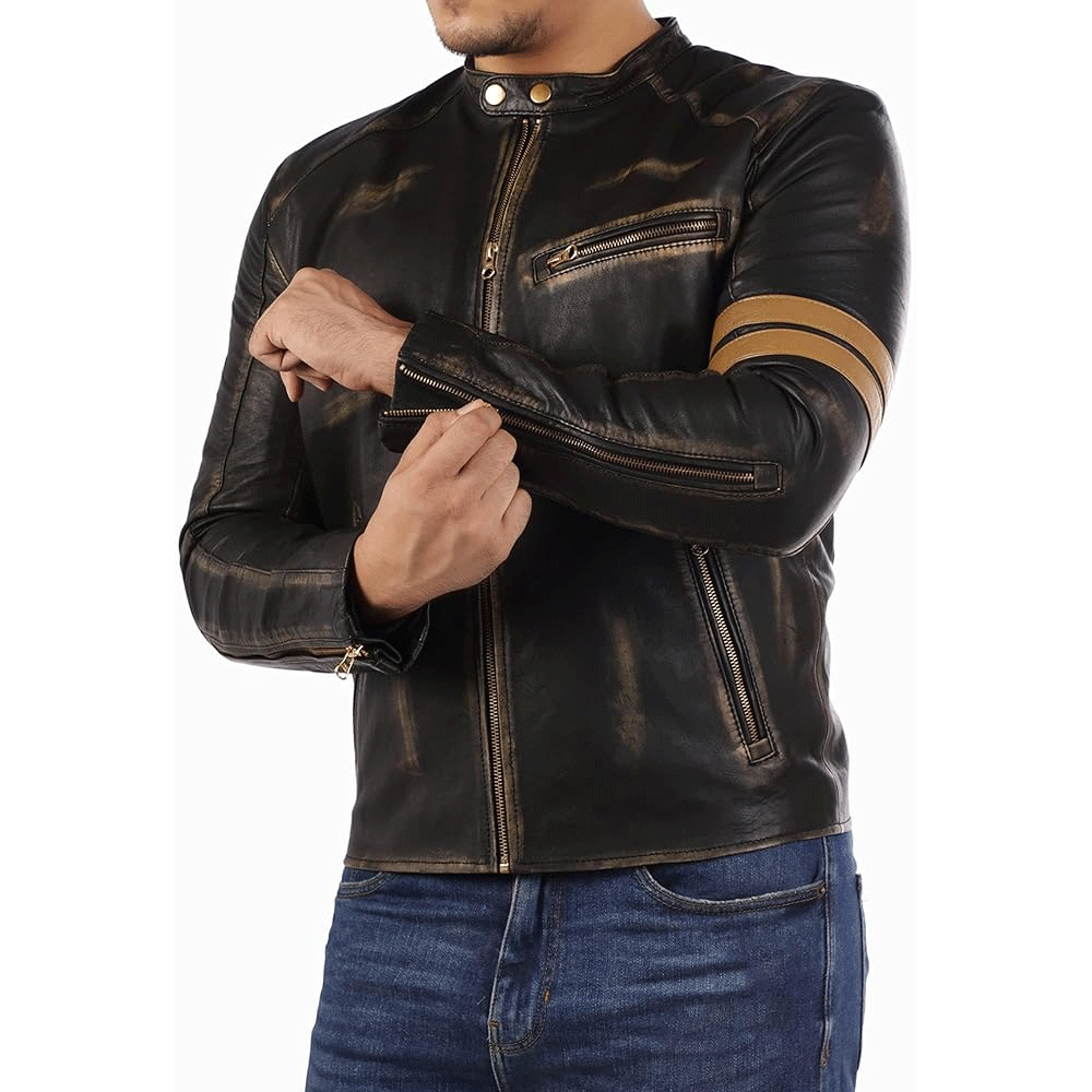 A man wearing a black leather motorcycle jacket with a distinctive orange stripe design, featuring pockets at the elbows and shoulders, and leather accents.