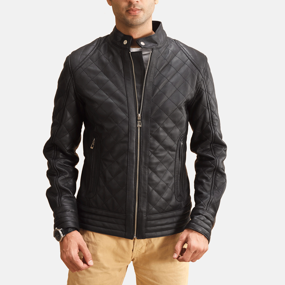 A man wearing a black leather motorcycle jacket with a quilted design, featuring a zipper front and pockets on the elbows and shoulders.