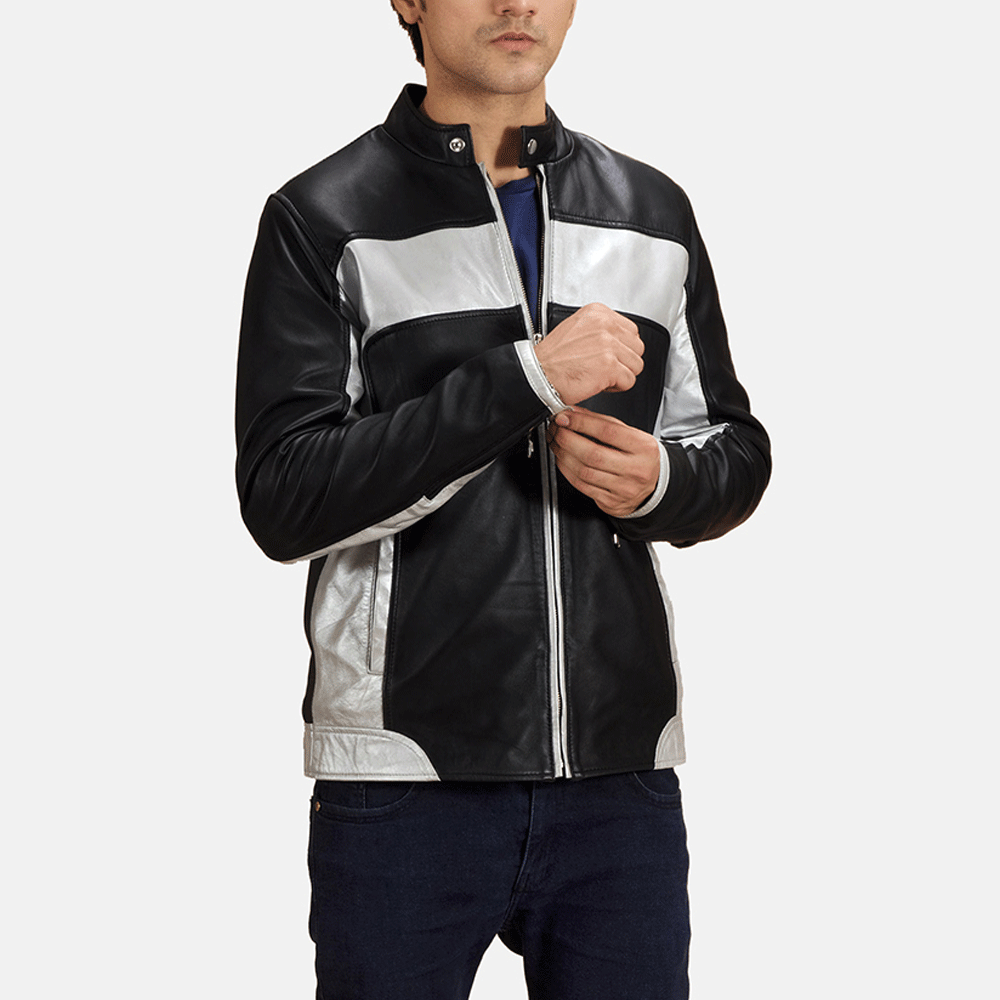 A man wearing a black and silver leather motorcycle jacket with a standing collar, zipper details, and orange stripe design on the sleeves.